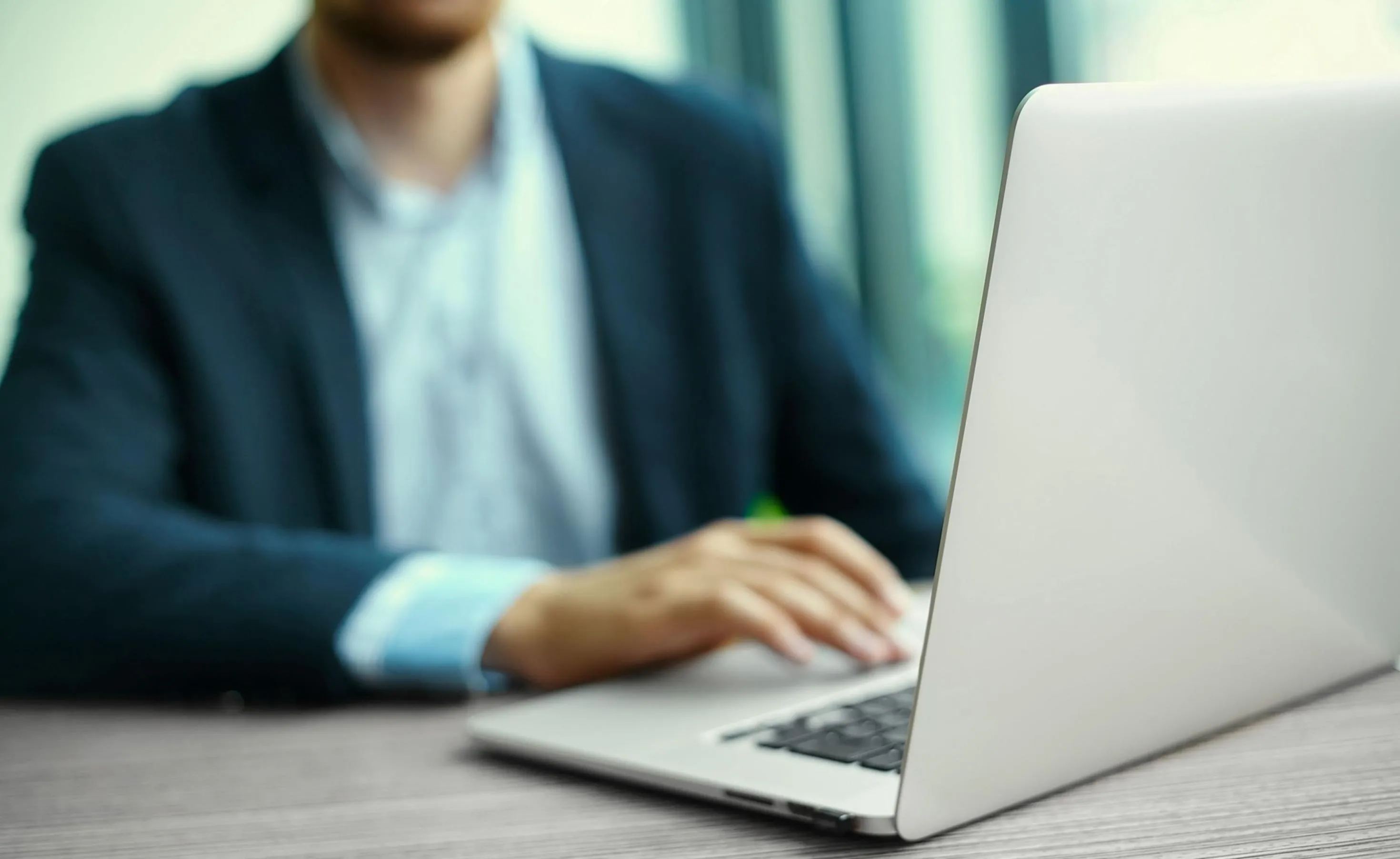 Cost management professional reviewing financial data at a workstation